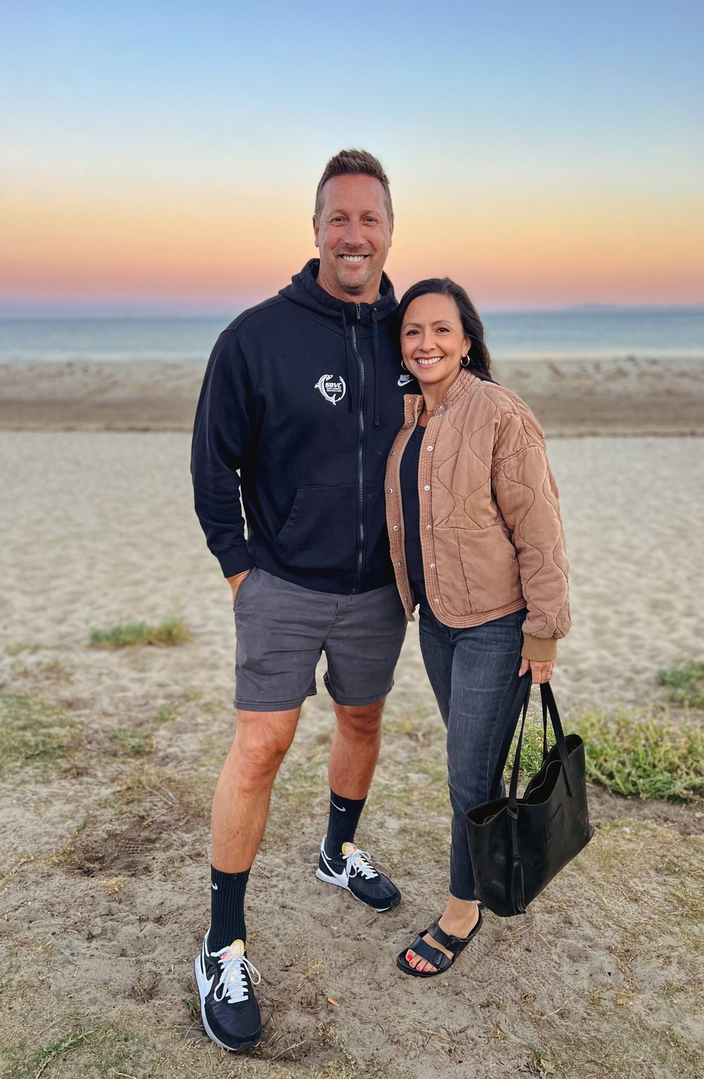 Todd and Melissa Shea on the beach at sunset