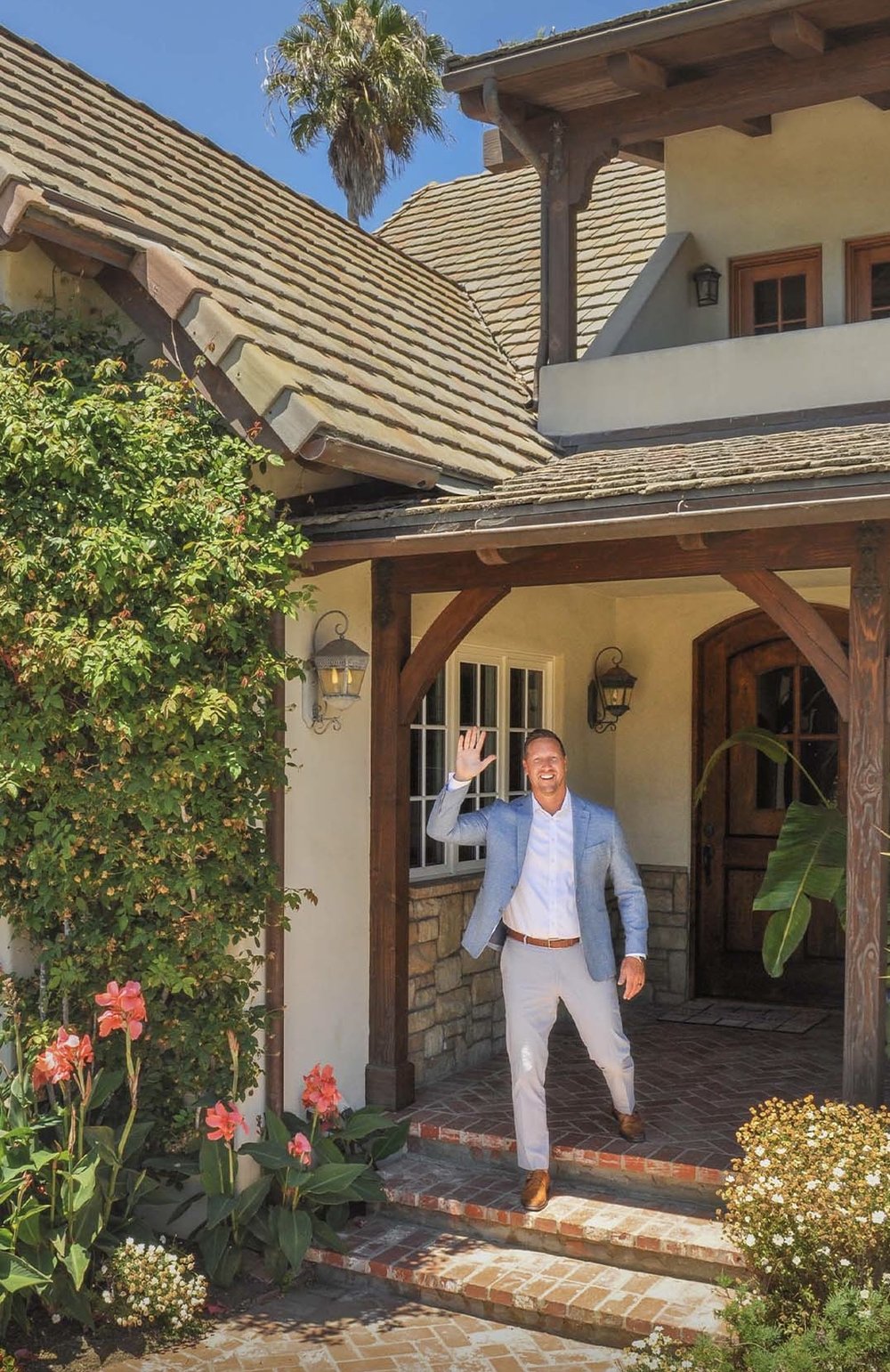 Todd Shea at the front door of a Santa Barbara listing