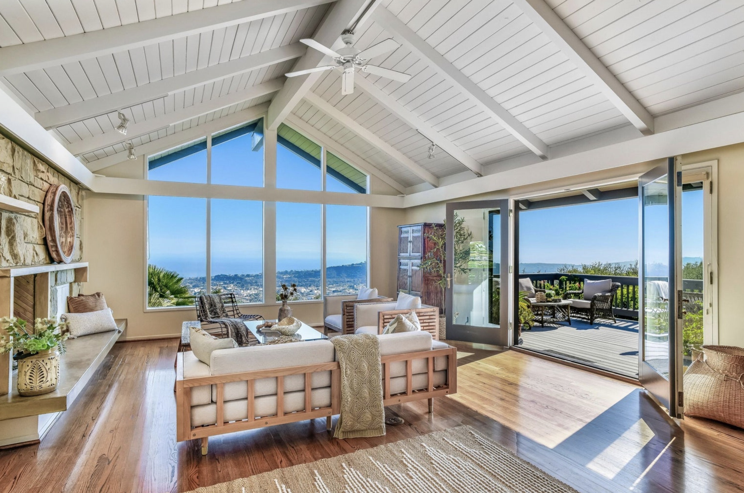 Living room with vaulted ceilings and ocean view at 1510 Franceschi Road