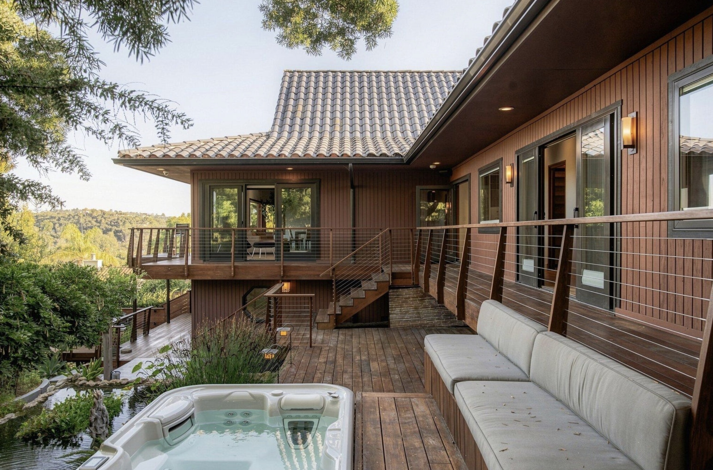 Wraparound deck with hot tub and koi ponds at 304 Sherwood Drive