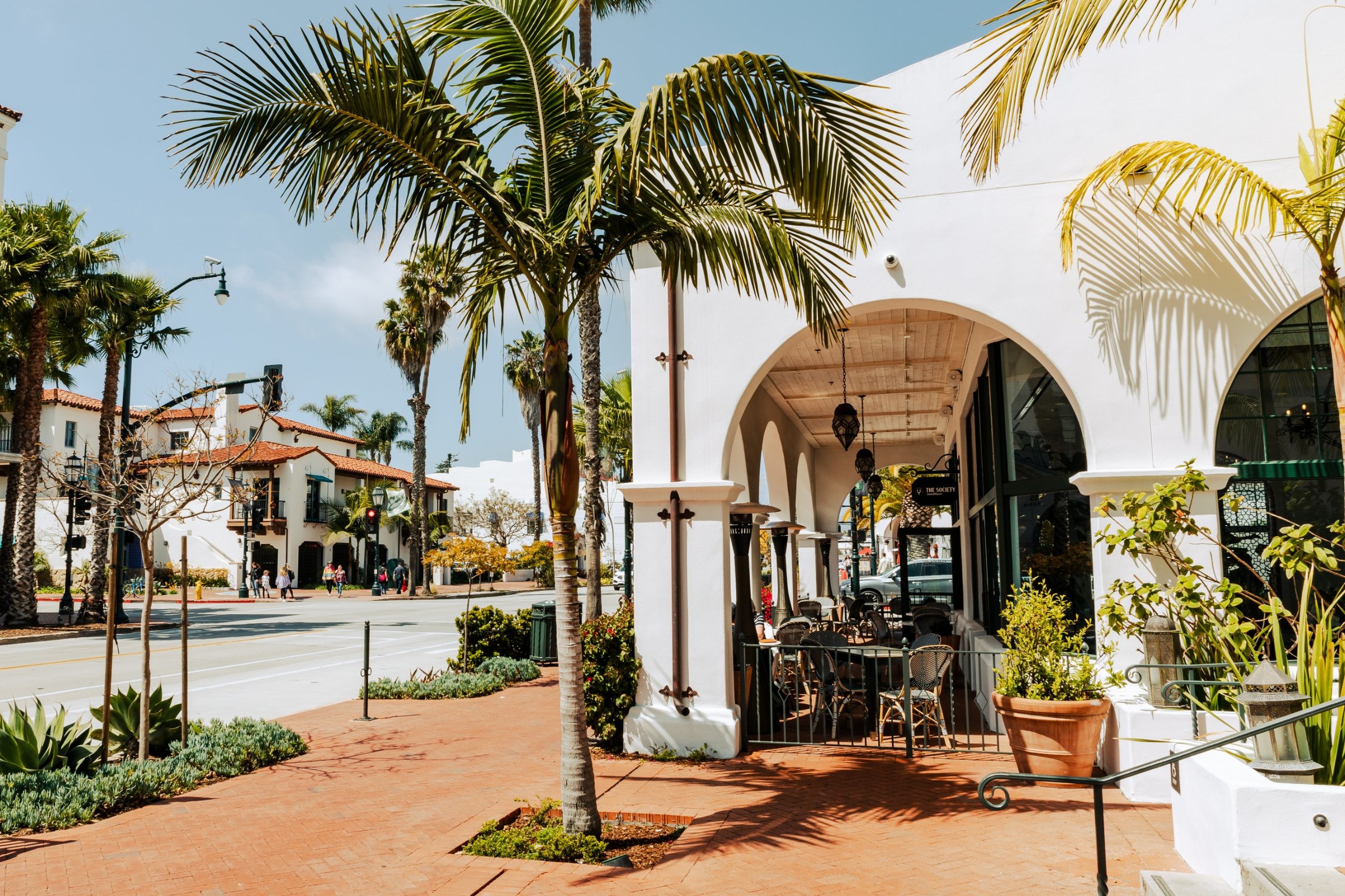 Palm trees and a whitewashed Spanish arcade on a downtown Santa Barbara corner